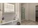 Bathroom with bathtub, shower, and walk-in closet at 5656 N 109Th Ave, Phoenix, AZ 85037