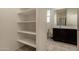 Bathroom with linen closet and single sink vanity at 5656 N 109Th Ave, Phoenix, AZ 85037