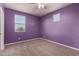 Purple bedroom with ceiling fan and window at 5656 N 109Th Ave, Phoenix, AZ 85037