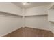 Spacious walk-in closet with double hanging rods at 5656 N 109Th Ave, Phoenix, AZ 85037