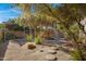 Landscaped backyard oasis with stepping stones and a water feature at 5777 N 78Th Pl, Scottsdale, AZ 85250