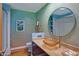 Spa-like bathroom with a vessel sink and blue walls at 5777 N 78Th Pl, Scottsdale, AZ 85250