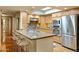 Modern kitchen featuring granite countertops and stainless steel appliances at 5777 N 78Th Pl, Scottsdale, AZ 85250