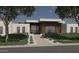 Modern home with wood and white exterior, walkway, and landscaping at 6026 E Pershing Ave, Scottsdale, AZ 85254