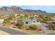 Aerial view of single-story home with large lot and mountain views at 605 N Star Ct, Apache Junction, AZ 85119