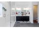 Spa-like bathroom featuring a frameless shower, double vanity, and grey wood-look flooring at 605 N Star Ct, Apache Junction, AZ 85119