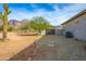 Home's side view, showing desert landscaping and AC unit at 605 N Star Ct, Apache Junction, AZ 85119