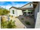 Relaxing front patio with seating area, fountain, and desert landscaping at 605 N Star Ct, Apache Junction, AZ 85119