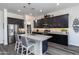 Spacious kitchen with dark cabinetry and granite countertops at 605 N Star Ct, Apache Junction, AZ 85119