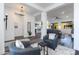 Open living room with gray seating and views into the entryway at 605 N Star Ct, Apache Junction, AZ 85119