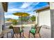 Outdoor patio with seating area under a yellow umbrella at 605 N Star Ct, Apache Junction, AZ 85119