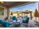 Relaxing covered patio with seating area and mountain views at 605 N Star Ct, Apache Junction, AZ 85119