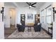 Charming sitting area with two armchairs, a rug, and a ceiling fan at 605 N Star Ct, Apache Junction, AZ 85119