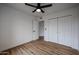 Spacious bedroom featuring ample closet space and wood-look floors at 619 N Norfolk --, Mesa, AZ 85205