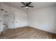 Spacious bedroom with ceiling fan, wood flooring and built in closet at 619 N Norfolk --, Mesa, AZ 85205