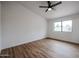 Bright bedroom with ceiling fan and wood-look flooring at 619 N Norfolk --, Mesa, AZ 85205