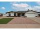 Charming single-story home with a two-car garage and landscaped yard at 619 N Norfolk --, Mesa, AZ 85205