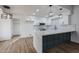 Modern kitchen featuring white shaker cabinets and a large island at 619 N Norfolk --, Mesa, AZ 85205