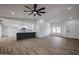 Open living room with hardwood floors and a view of the kitchen at 619 N Norfolk --, Mesa, AZ 85205