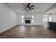 Living room with hardwood floors, fireplace and large windows at 619 N Norfolk --, Mesa, AZ 85205