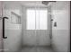 Walk-in shower with marble tile and a window for natural light at 619 N Norfolk --, Mesa, AZ 85205