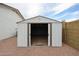 White metal storage shed with double doors at 619 N Norfolk --, Mesa, AZ 85205