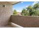 Private balcony with view of trees and surrounding buildings at 623 W Guadalupe Rd # 223, Mesa, AZ 85210