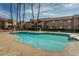 Community swimming pool with surrounding lounge chairs at 623 W Guadalupe Rd # 223, Mesa, AZ 85210