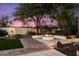 Landscaped backyard with fire pit, offering a tranquil outdoor space at 6601 E Valley Vista Ln, Paradise Valley, AZ 85253