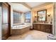 Bathroom with soaking tub and double vanity at 6601 E Valley Vista Ln, Paradise Valley, AZ 85253