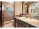 Elegant bathroom with tiled shower and wood vanity at 6601 E Valley Vista Ln, Paradise Valley, AZ 85253