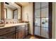 Elegant bathroom features a vanity with wood cabinets and a large mirror at 6601 E Valley Vista Ln, Paradise Valley, AZ 85253