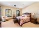 Spacious bedroom with wood furniture and large windows at 6601 E Valley Vista Ln, Paradise Valley, AZ 85253