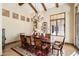 Elegant dining room featuring a large wood table, chandelier, and hardwood floors at 6601 E Valley Vista Ln, Paradise Valley, AZ 85253