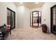 Bright and airy entryway with tiled floors and French doors at 6601 E Valley Vista Ln, Paradise Valley, AZ 85253