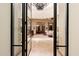 Elegant entryway with glass doors opening to a spacious living area at 6601 E Valley Vista Ln, Paradise Valley, AZ 85253