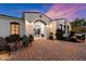 Inviting front patio with brick pavers and comfortable seating area at 6601 E Valley Vista Ln, Paradise Valley, AZ 85253