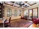 Home office with built-in shelving and hardwood floors at 6601 E Valley Vista Ln, Paradise Valley, AZ 85253