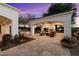 Backyard patio features a cozy fireplace and comfortable seating for outdoor entertainment at 6601 E Valley Vista Ln, Paradise Valley, AZ 85253