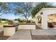 Outdoor kitchen with stainless steel grill and brick counter at 6601 E Valley Vista Ln, Paradise Valley, AZ 85253