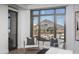 Bedroom seating area boasts a picturesque view of the city and desert mountain at 7175 E Camelback Rd # 601, Scottsdale, AZ 85251