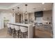 Beautiful kitchen featuring a quartz island with seating, stainless steel appliances, and modern cabinetry at 7175 E Camelback Rd # 601, Scottsdale, AZ 85251