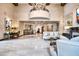 Upscale lobby featuring a grand chandelier and fireplace at 7175 E Camelback Rd # 601, Scottsdale, AZ 85251