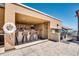 Outdoor kitchen area with grill, bar seating, and granite countertops at 7175 E Camelback Rd # 601, Scottsdale, AZ 85251