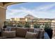 Comfortable patio furniture overlooks the cityscape and distant mountains, perfect for relaxation and enjoying the scenery at 7175 E Camelback Rd # 601, Scottsdale, AZ 85251