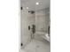 Sleek glass shower with modern tilework, rain shower head, and built-in bench at 7175 E Camelback Rd # 601, Scottsdale, AZ 85251