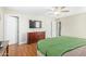 Main bedroom with a ceiling fan, dresser, and walk-in closet at 7244 S Sunrise Way, Buckeye, AZ 85326