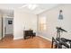 Bright bedroom with wood floors and an ensuite bathroom at 7244 S Sunrise Way, Buckeye, AZ 85326