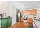 Well-equipped kitchen featuring stainless steel appliances and wood cabinets at 7244 S Sunrise Way, Buckeye, AZ 85326