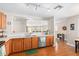 Bright kitchen with stainless steel appliances and light wood cabinets at 7244 S Sunrise Way, Buckeye, AZ 85326